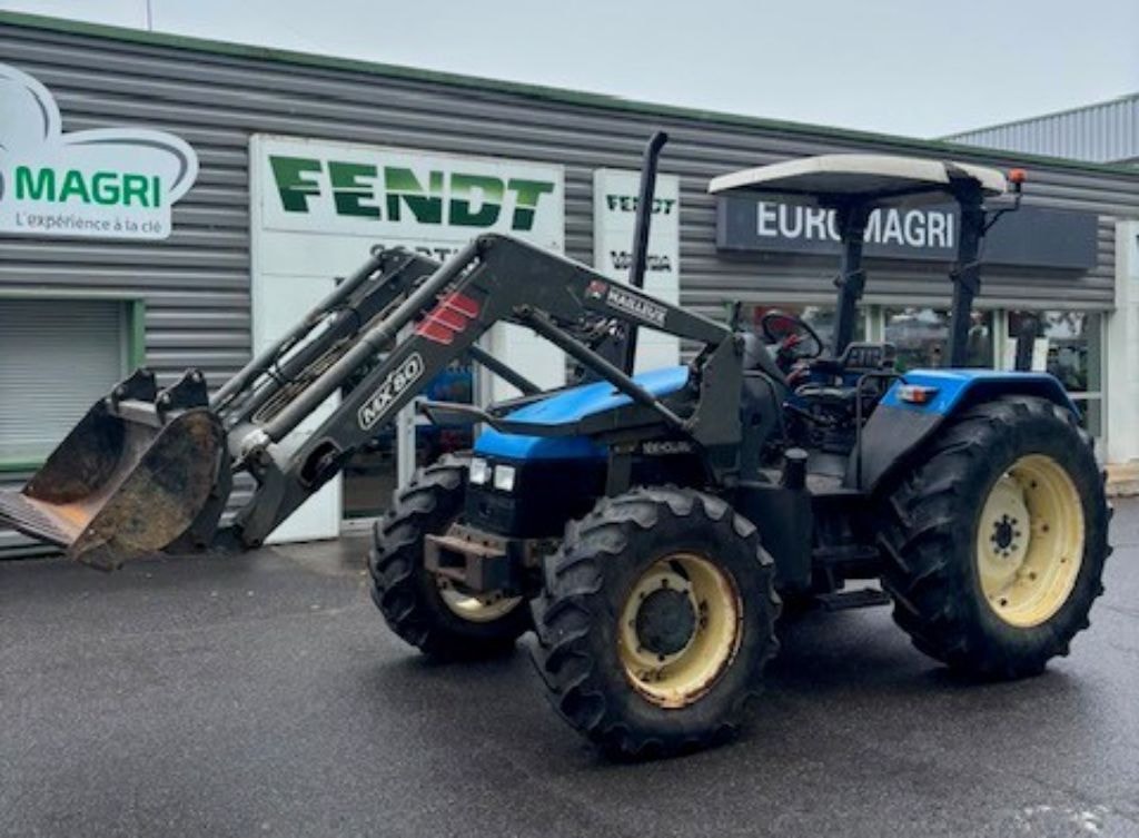 Tracteur chargeur NEW HOLLAND TL 90 - photo slide 1