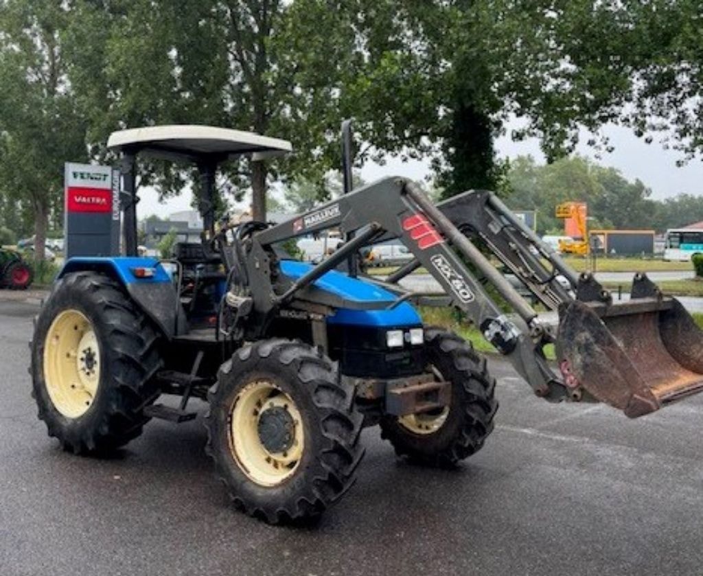 Tracteur chargeur NEW HOLLAND TL 90 - photo slide 2